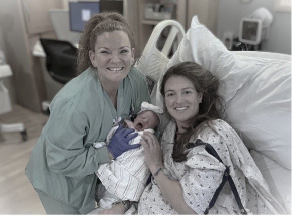 Kim Heathcote, RN with New Parents and Newborn Baby